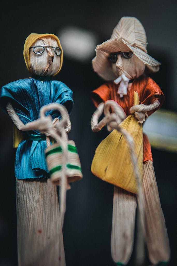 Close-up shot of traditional Mexican corn husk dolls with vibrant clothing.