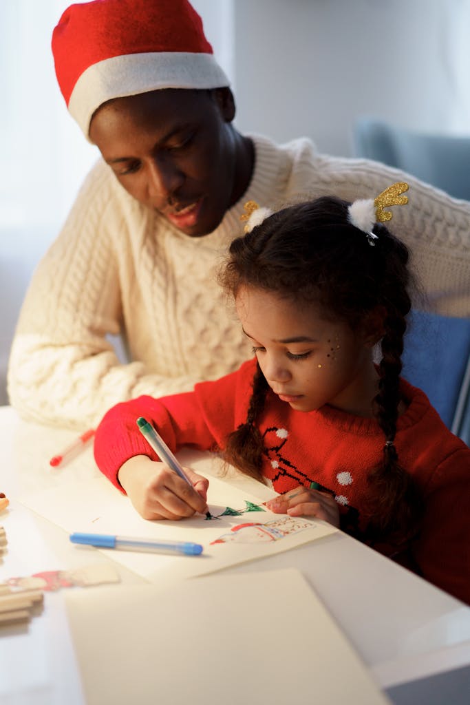 A father and daughter making Christmas crafts together at home, highlighting family bonding and creativity during the holiday season.
