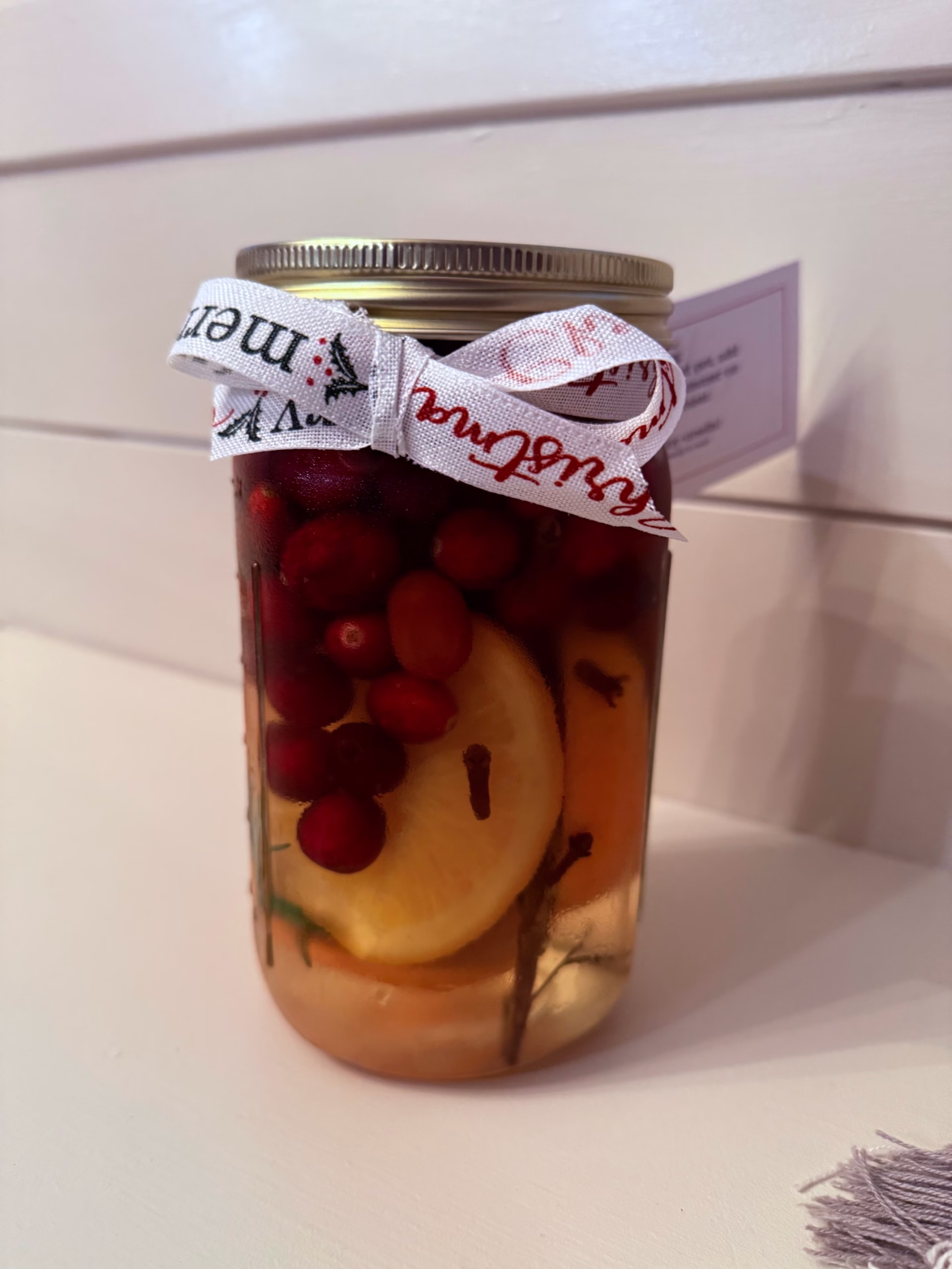 holiday simmer pot mason jar tied with ribbon